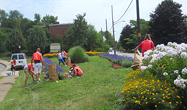 Volunteers weed at the Homewood Community Flower Garden, Summer 2011