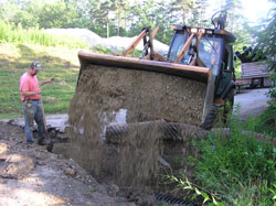 WPC staff install a culvert, which will help
channel water.