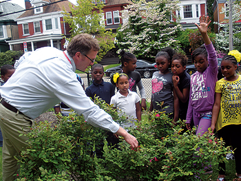 Ephraim Zimmerman, an ecologist at the Conservancy, interacts with students at Fulton Elementary School’s Nature Yard.  