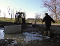 WPC staff members help install an alternative watering source
for livestock on a dairy farm in Indiana, Pa.