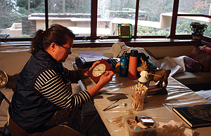 Victoria Jefferies, a wood conservator, works on 
some of the objects in the Fallingwater collections.  