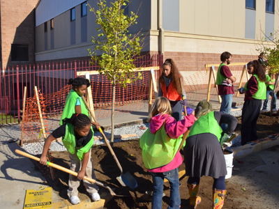  Students planting trees at Barrett Elementary.