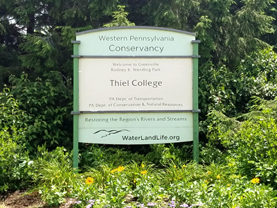 WPC Gardens Thiel College Sign