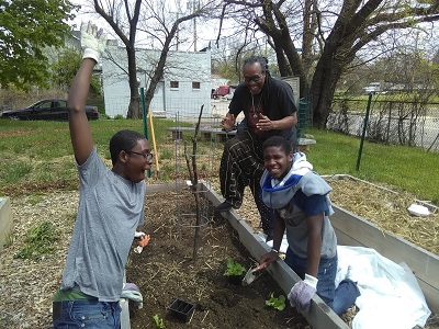 Community members celebrate planting a garden bed in a community vegetable garden funded by WPC and GrowPittsburgh. 