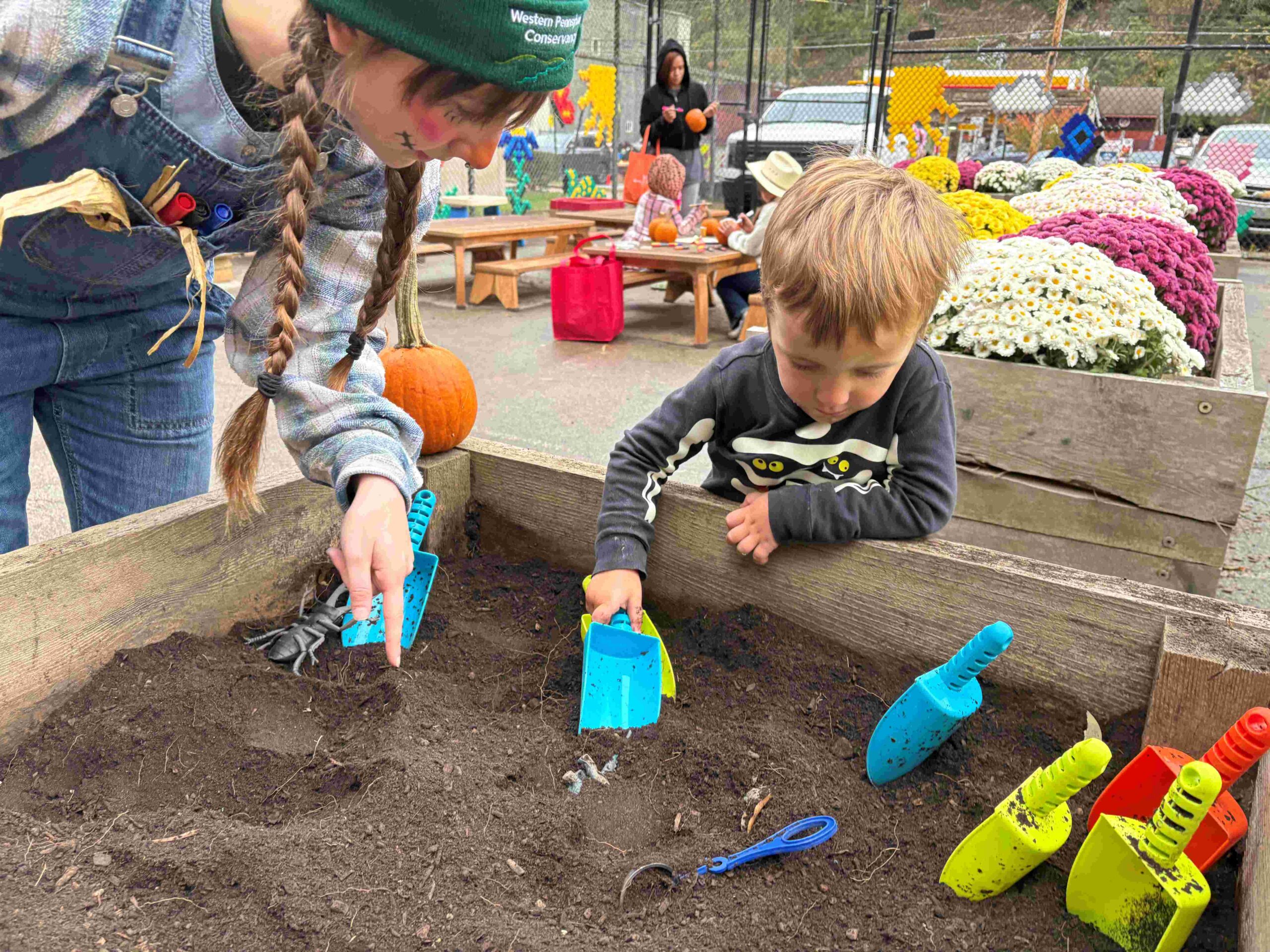 Student at play at Ribbon-Cutting, Pumpkin Patch for New Natural Play Space at PPS Spring Garden Early Childhood