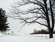 Snow covered field and farmhouse in Western PA